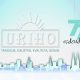 Ova slika je logo tvrtke URIHO. Logo se sastoji od bijelog pravokutnika s riječju URIHO u sredini i dizajnom sunčeve svjetlosti iznad njega. Logo ima i slogan 'tradicija, iskustvo, kvaliteta, dizajn' ispod riječi URIHO. Pozadina slike je plavi gradijent sa siluetom obrisa grada na dnu. Tu je i natpis '77. rođendan'.