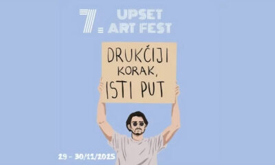 Ilustrirani plakat festivala „7. Upset Art Fest“ s osobom koja drži natpis „Drukčiji korak, isti put“, uz naznačene datume održavanja 29.–30. studenoga 2025.