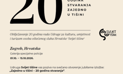 Na fotografiji je prikazan promotivni plakat Udruge za kulturu, umjetnost i turizam osoba oštećenog sluha Hrvatske „Svijet tišine“, kojim se najavljuje obilježavanje 20 godina rada Udruge. Plakat je minimalistički oblikovan na svijetloj, bež podlozi. U gornjem dijelu dominira veliki crni broj „20“, uz koji stoji poruka „GODINA STVARANJA ZAJEDNO U TIŠINI“. Ispod je navedeno da se obilježava 20 godina rada Udruge „Svijet tišine“. U središnjem dijelu istaknuta je informacija o održavanju izložbe u Zagrebu, u Galeriji Specijalne policije, od 1. do 15. listopada 2026. godine. Posebno je najavljeno svečano otvorenje izložbe „Zajedno u tišini – 20 godina stvaranja“, koje će se održati u četvrtak, 1. listopada u 19 sati, na adresi Trg žrtava fašizma 1 u Zagrebu. U donjem dijelu plakata nalazi se poziv građanima da se pridruže obilježavanju i proslave 20 godina rada, stvaranja i zajedništva. Na desnoj strani nalazi se prepoznatljiv logotip Udruge „Svijet tišine“.